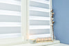 Candles with inscription home windowsill with beautiful blinds